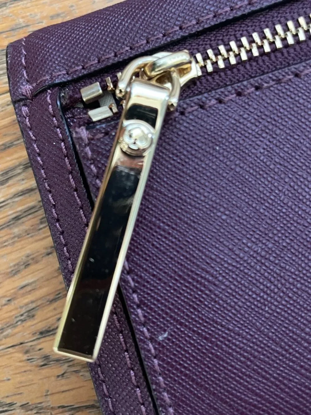 Kate Spade Large bi- Fold wallet in Deep Plum